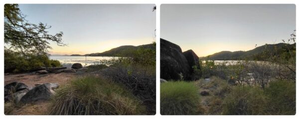 Západ slunce nad mořem u Magnetic Island, s tmavými siluetami kopců na obzoru a skalami v popředí.